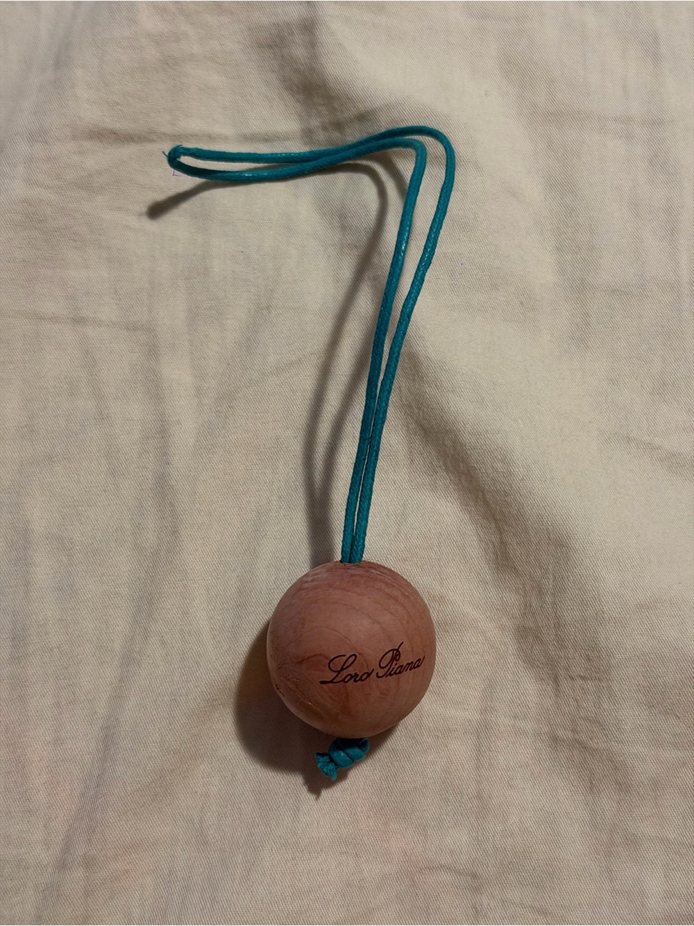 Loro Piana Turquoise Leather Cord with Wooden Bead Charm